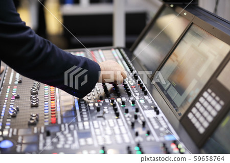 working with broadcast audio mixing console 59658764