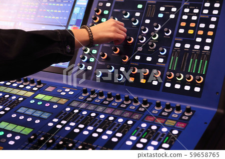 sound engineer working with digital mixing console 59658765
