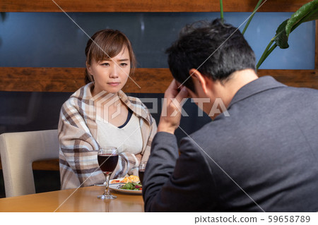 Men and women eating in a restaurant Men and women eating in a restaurant 59658789