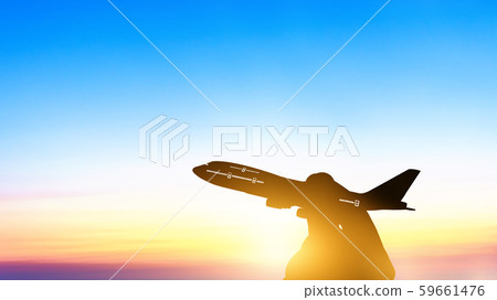 Silhouette of young asian holding miniature toy 59661476