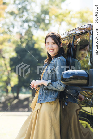 Young woman and light car 59663614