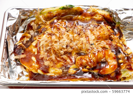 Kansai-style okonomiyaki placed in a disposable lunch box for take-out. 59663774