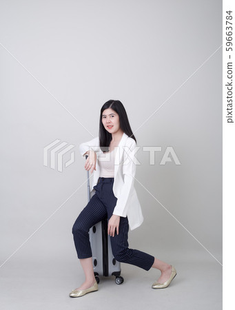 Young Asian woman tourist with luggage to travel Young Asian woman tourist with luggage to travel 59663784