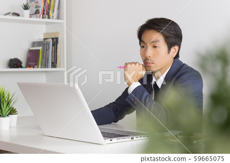Asian Financial Advisor or Asian Consulting Businessman Seriously Thinking Asian Financial Advisor or Asian Consulting Businessman Seriously Thinking 59665075
