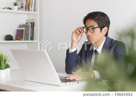 Asian Financial Advisor or Asian Consulting Businessman Seriously Calculate Financial Data Asian Financial Advisor or Asian Consulting Businessman Seriously Calculate Financial Data 59665082