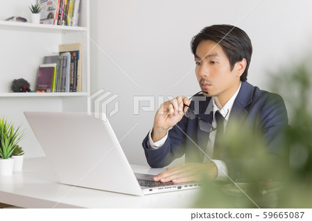 Asian Financial Advisor or Asian Consulting Businessman Serious with Financial Information Asian Financial Advisor or Asian Consulting Businessman Serious with Financial Information 59665087