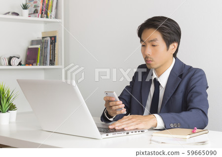 Asian Financial Advisor or Asian Consulting Businessman Sending Message or Chat Asian Financial Advisor or Asian Consulting Businessman Sending Message or Chat 59665090
