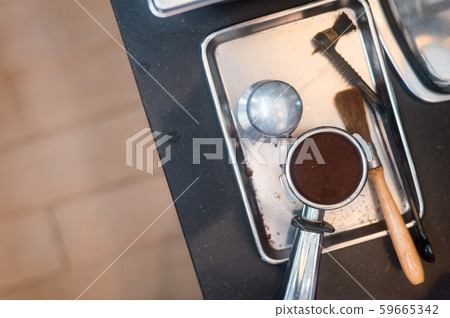 Coffee powder on coffee tamper Coffee powder on coffee tamper 59665342