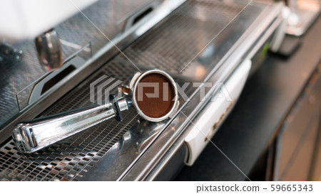 Coffee powder on coffee tamper Coffee powder on coffee tamper 59665343