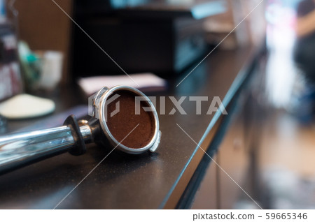 Coffee powder on coffee tamper Coffee powder on coffee tamper 59665346