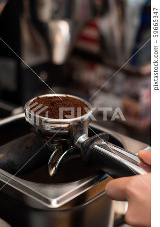 Coffee powder on coffee tamper Coffee powder on coffee tamper 59665347