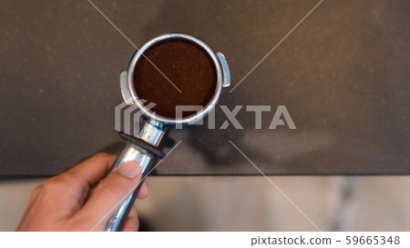 Coffee powder on coffee tamper Coffee powder on coffee tamper 59665348