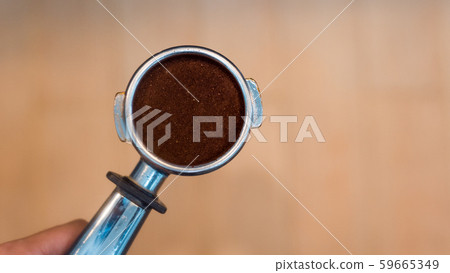 Coffee powder on coffee tamper Coffee powder on coffee tamper 59665349