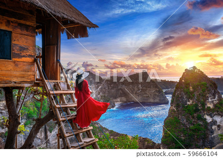 Young girl on steps of house on tree at sunrise Young girl on steps of house on tree at sunrise 59666104