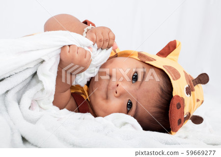 Cute little boy lying on soft blanket 59669277