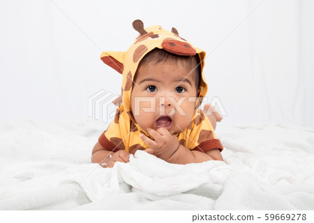 Cute little boy lying on soft blanket 59669278