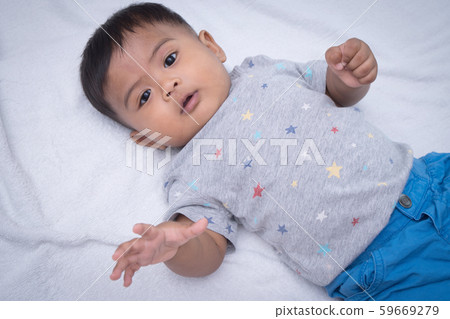 Cute asian little baby lying on blanket 59669279