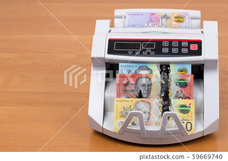 Australian money in a counting machine Australian money in a counting machine 59669740