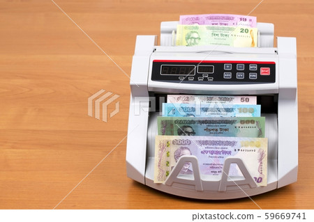 Money from Bangladesh in a counting machine 59669741
