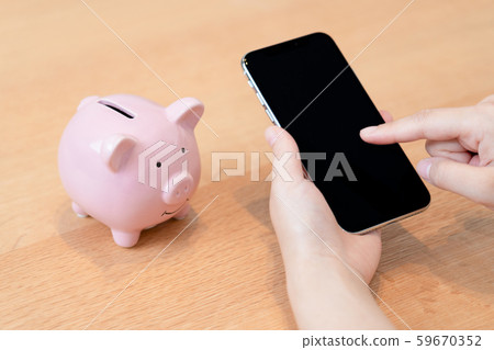 Pig money box and smartphone 59670352