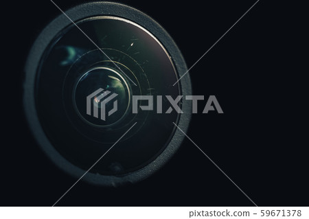 Close up dust and peel scratch on a camera lens 59671378