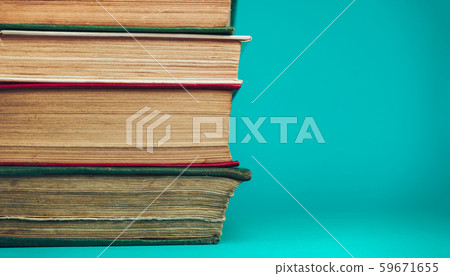 Beautiful old books on a table aquamarine 59671655