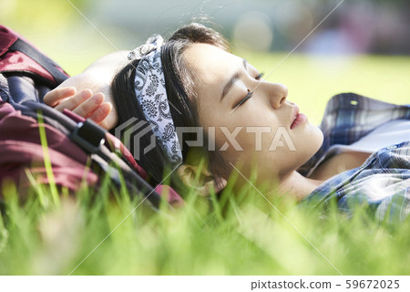 Woman lying on the grass 59672025