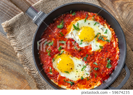 Shakshouka served in a frying pan Shakshouka served in a frying pan 59674235