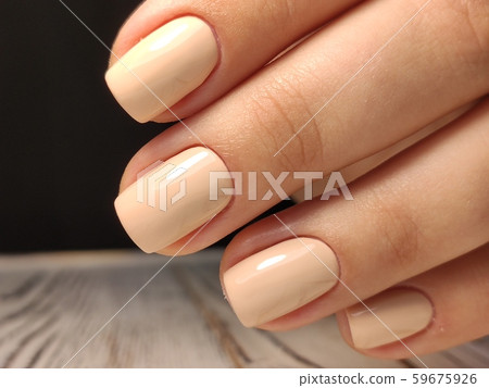 Gray striped nail design on female hand close up. Gray striped nail design on female hand close up. 59675926