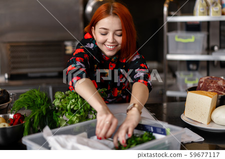 Beautiful young red-haired girl in evening dress Beautiful young red-haired girl in evening dress 59677117