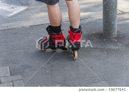 Close-up legs of teenagers riding roller skating Close-up legs of teenagers riding roller skating 59677641