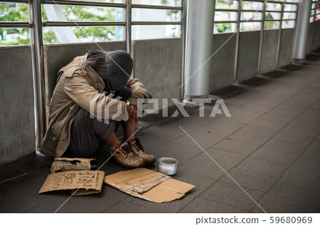 Sad Homeless old man in city 59680969