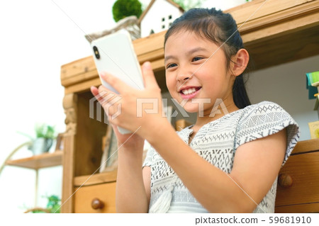 Child image of operating smartphones with fun Child image of operating smartphones with fun 59681910