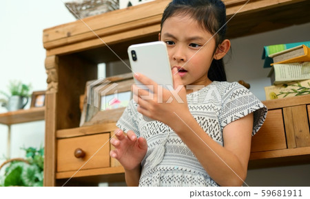 Child image of operating smartphone Child image of operating smartphone 59681911
