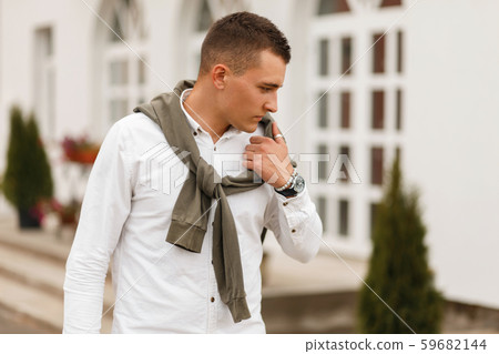 Stylish young handsome model man with a haircut Stylish young handsome model man with a haircut 59682144