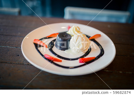 hot chocolate lava cake with vanilla ice cream and 59682874