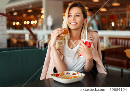 Satisfied beautiful young woman with a smile 59684194