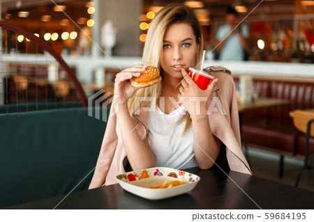 American beautiful young model woman eating American beautiful young model woman eating 59684195