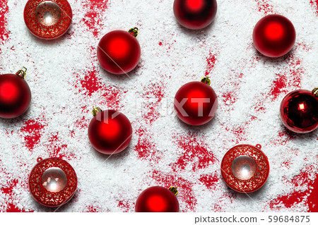 Red Christmas balls and white snow on red background. Flat lay. 59684875