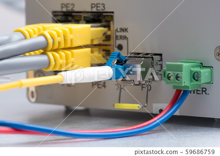 Fiber optic and network ethernet patch cord cable connect to the switch Fiber optic and network ethernet patch cord cable connect to the switch 59686759