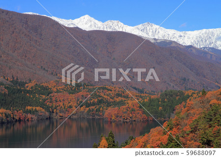 Three snow-covered Hakuba mountains and Aoki lake in late autumn Three snow-covered Hakuba mountains and Aoki lake in late autumn 59688097