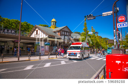 Tokyo cityscape in Japan Ambulance driving with sirens in front of Harajuku station 59689288