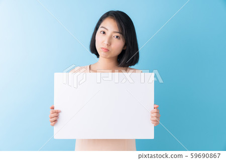 Thinking of a woman with a white board Thinking of a woman with a white board 59690867
