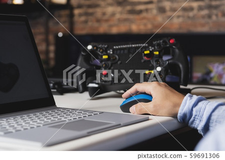 Working on a laptop 59691306