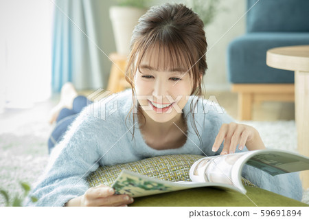 Ladies living room magazine book read prone Ladies living room magazine book read prone 59691894