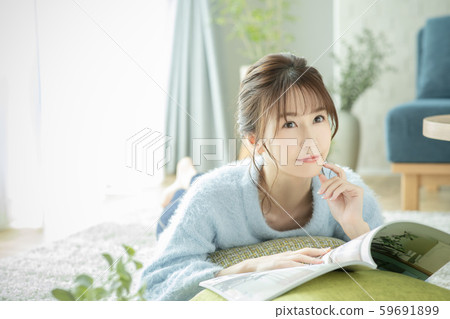 Ladies living room magazine book read prone Ladies living room magazine book read prone 59691899
