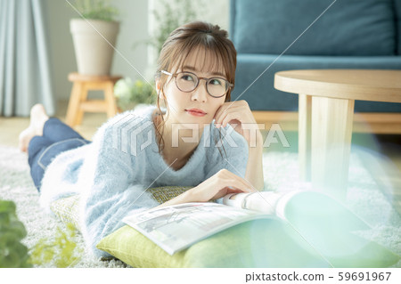 Ladies living room magazine book read prone Ladies living room magazine book read prone 59691967