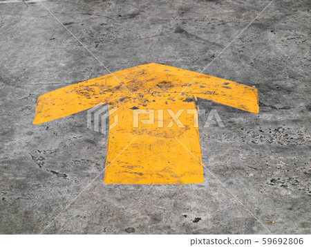 Arrow signs as road markings on a street Arrow signs as road markings on a street 59692806