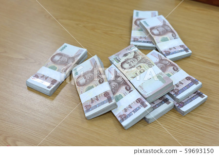 one million baht of thai money currency put on table business office financial 59693150