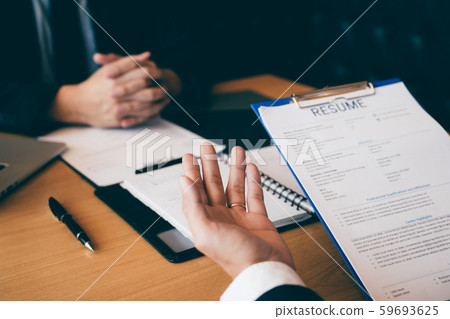 Job seekers are talking to job interviewers and 59693625